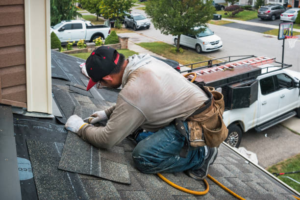 Professional Roof Repair technician working in Hyde Park, MA